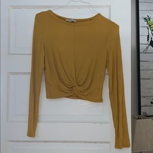 Long sleeve yellow top with a twist